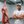 Load image into Gallery viewer, side of beef hanging in a state of the art cooler with a handsome muscular butcher with arms crossed
